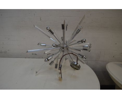 A perspex and chromed ceiling light of abstract form.