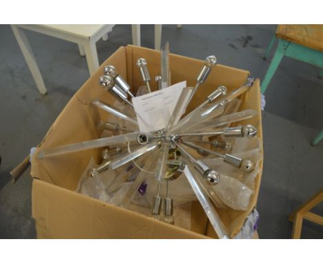 A contemporary chromed and perspex light fitting of abstract design.