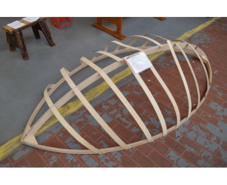 A Christmas display item in the form of a boat hull, length 240cm.