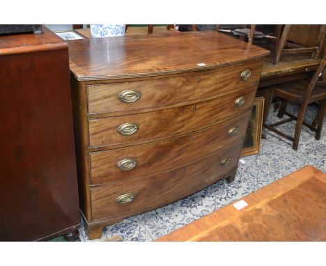 A George III bow front chest, crossbanded top, boxwood and satinwood stringing, reeded edge, four cockbeaded graduated drawer