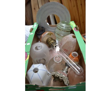 A Victorian glass oil lamp decorated with flowers on a brown ground;  a glass lamp shade decorated with a pond yacht on a ora