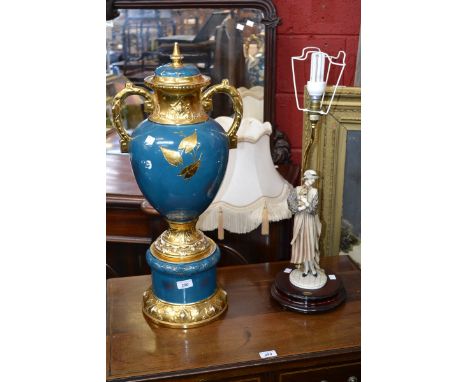 A twin handled pedestal vase and cover, gilded throughout; a Neapolitan figural table lamp (2) 