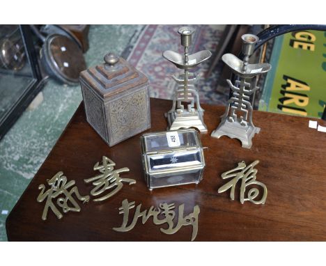 A pair of Asian brass candle sicks;  Persian style tea caddy;  good luck signs etc 