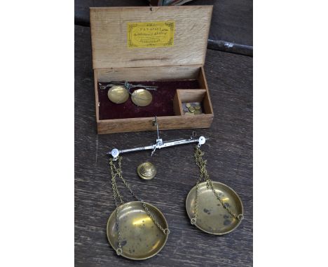 A pair of 19th century brass and steel travelling beam scales, by W & T Avery, Birmingham, six graduated troy oz cup weights,