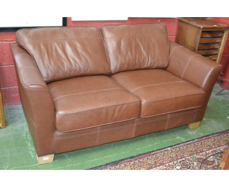 A modern designer two seat leather sofa