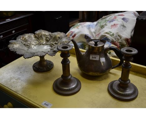 A silver plate pedestal fruit bowl decorated with grapes and leaves;  an EPNS teapot;  a pair of copper filled candlesticks (