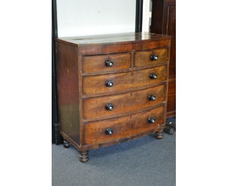 A Victorian mahogany and walnut bow front chest of drawers, c.1860