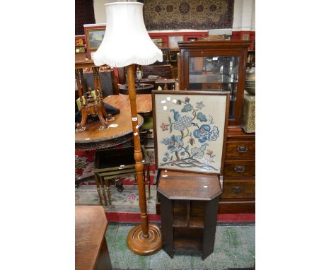 An oak standard lamp, an embroidered fire screen and an oak occasional table 