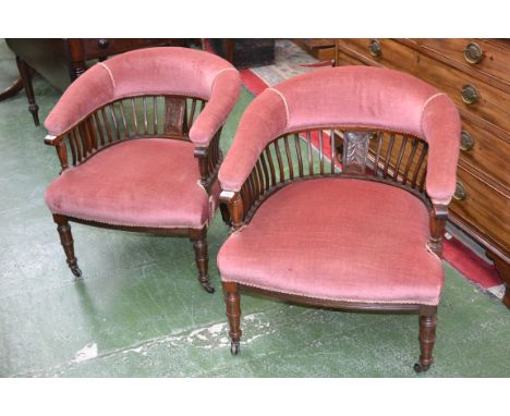A pair of Edwardian mahogany library chairs, padded horseshoe rail, carved splat, lath slats, stuffed overseat, turned forele