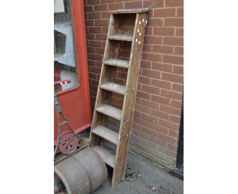A set of vintage pine step ladders