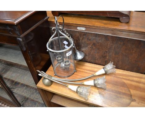 A 1950's brass wall light; a glass and metalwork lantern (2)