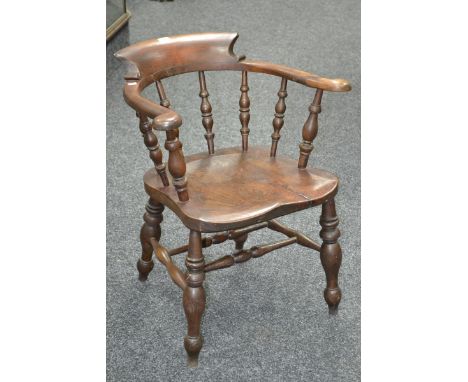 A late 19th century elm smoker's bow chair, stamped with LNWR to seat, possibly from Monsaldale Station