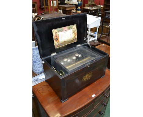 A large 19th century Swiss rosewood and marquetry music box, the 33cm cylinder playing twelve airs on a two-piece comb and si