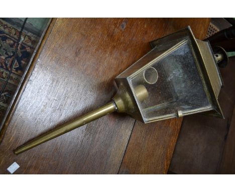 An early 20th century brass lamp converted for electricity.