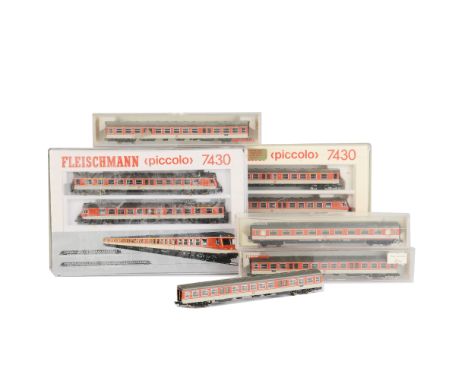 Fleischmann Continental N Gauge Railcars and Coaching Stock, Piccolo 2-Car Sets 7430 in orange and off white together with ei