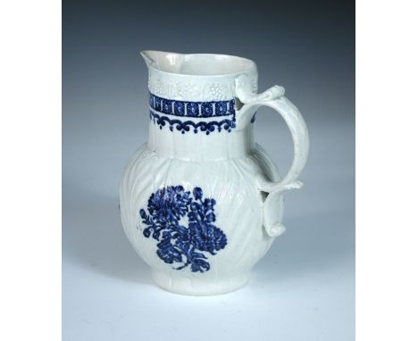 A Liverpool mask jug, possibly Christian's factory, the leaf moulded body printed with two butterflies and three bunches of f