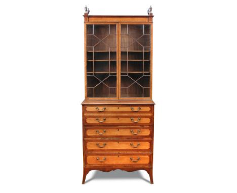 A Sheraton period satinwood and mahogany secretaire bookcase, with urn finials and astragal glazed doors to the top half with