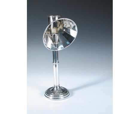 An electroplate student candle lamp and shade, unmarked, the circular stepped foot below a cylindrical stem with moulded knop