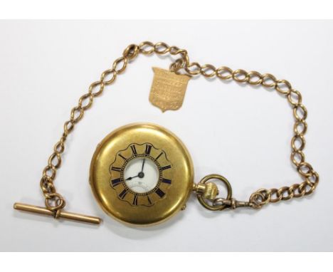 W H & S Jackson (Clerkenwell) - an 18ct gold half hunter cased pocket watch, with enclosed keyless three quarter plate moveme