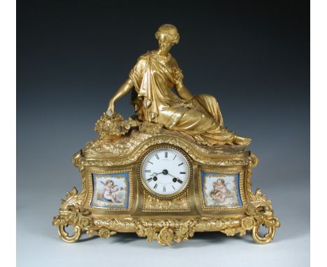 A 19th century French ormolu mantle clock, the case with a seated classical female figure above enamel dial signed for Miroy 