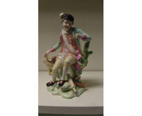 A patch marked Derby figure respresenting sight, he sits resting his right hand on the head of an eagle spreading its wings, 