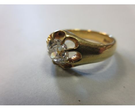 A gentleman's single stone diamond ring, the old mine cut stone flying claw set above lobed indentations in a plain tapered s