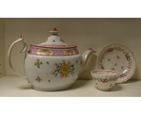 A New Hall tea pot and cover together with a Keeling tea bowl and saucer, the oval sectioned sides of the pot painted with pa