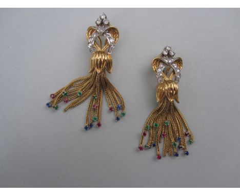 A pair of diamond and gemset tassel earclips, each designed as an interlocked heart and horseshoe set with round brilliant an