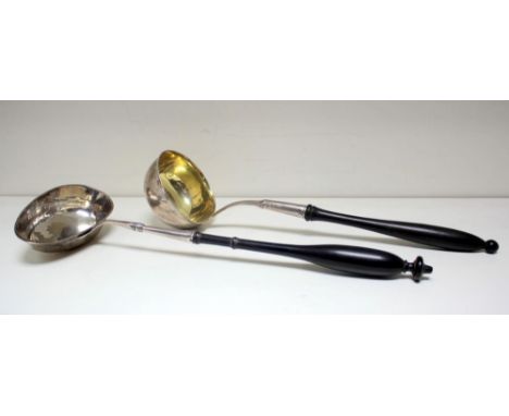 A large Swedish silver punch ladle, W?(N)H, Stockholm 1830, with oval bowl and turned wooden handle, 35cm; together with an e