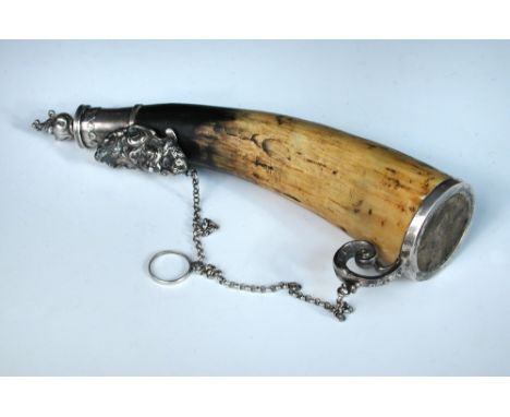 An early 19th century French silver mounted powder horn, the detachable cap with acorn finial above an applied mask of a bear