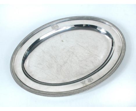 A George III silver meat plate, by Paul Storr, London 1800, oval with gadrooned edge, crested, 39cm diameter, 43.58oz  Some k