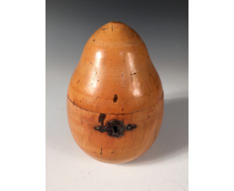 A turned fruitwood pear shaped tea caddy, with shaped iron escutcheon, the hinged top now lacking its stalk 16cm (6in)