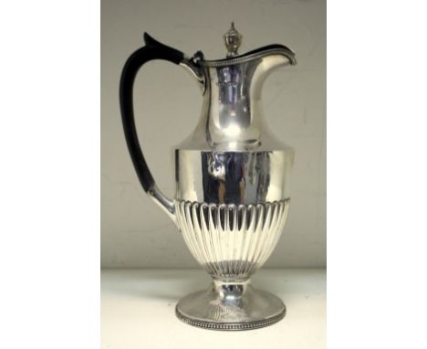 A late Victorian silver hot water jug, by Harrison Brothers & Howson, Sheffield 1897, the lower body vase shaped and half flu