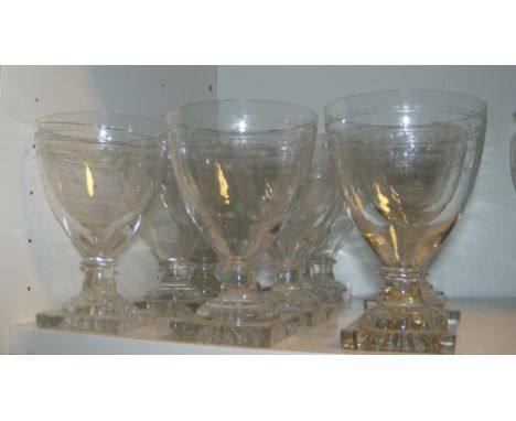 A set of twelve rummers, each of the rounded conical bowl engraved with stars and stipples, disc knops above the square lemon