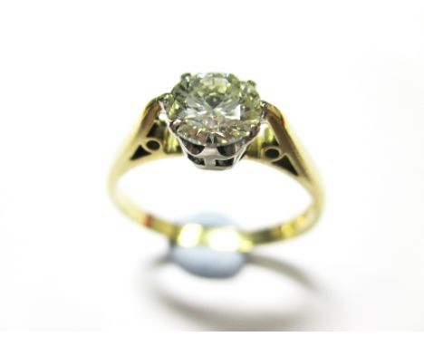 A millennium 18ct gold single stone diamond ring,  the round brilliant cut diamond, estimated weight 0.68cts six claw set to 