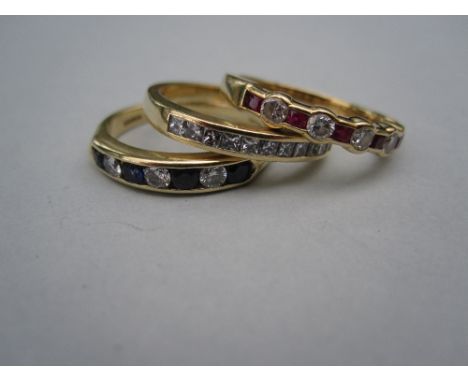 Three 18ct gold diamond and gemset half hoop rings, the first with eleven princess cut diamonds channel set to a plain band; 