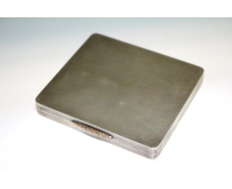 A silver cigarette case, by The Goldsmiths' & Silversmiths' Company Ltd, London 1935, rectangular and all over engine turned,