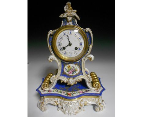 A French porcelain clock garniture, 19th century, marked for Jacob Pettit, the waisted scroll case with floral panels with gi