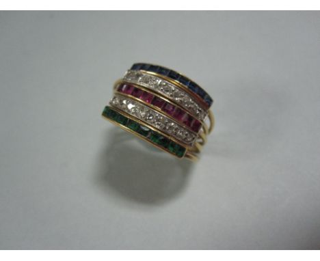 A five band diamond, ruby, emerald and sapphire ring, composed of five individual fine shanks gathered at the back with a fla