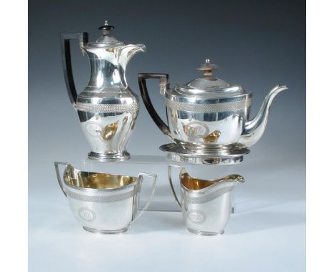 A George III silver four piece teaset, by John Emes, London 1804, comprising:- an oval teapot, the upper body engraved with a