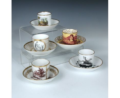 Six Regency coffee cans and saucers with landscape scenes, to include:a Minton 604 pattern yellow ground can and saucer paint