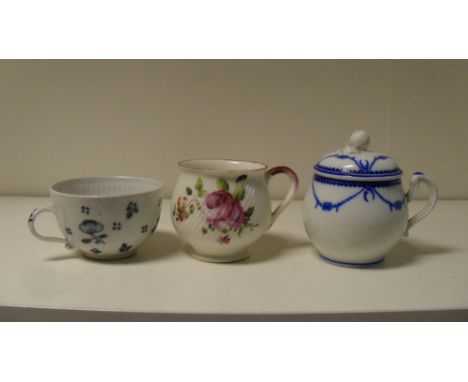 A Wallendorf cup, a Mennecy and another French blue and white custard cup with cover, the exterior of the first painted with 