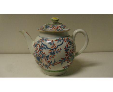 A Worcester tea pot and cover printed with blue flowers and overpainted in red and green, W mark (2) (R) The cover has beenin