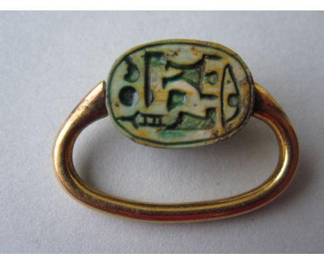 A small collection of Egyptian carved scarabs, the first a carved and turquoise glazed steatite bead set in a swivel ring (sh