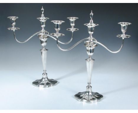 A pair of silver three light candelabra, by Hawkesworth Eyre & Co, Sheffield 1911, each raised on a lobed oval foot below a t