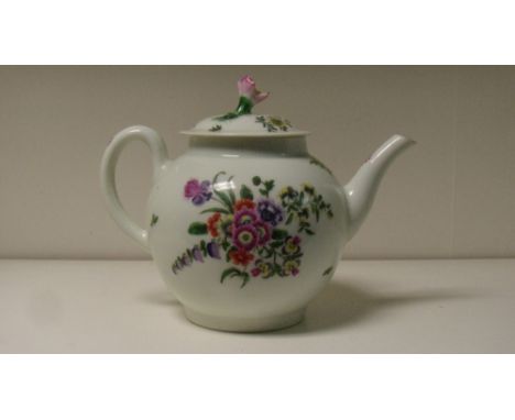 A Worcester tea pot and cover, each side painted with bunches of flowers, further coloured flowers scattered about the floral