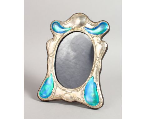 AN ART DECO DESIGN SILVER AND BLUE ENAMEL PHOTOGRAPH FRAME, with large blue enamel scrolls. 8ins x 5.5ins.
