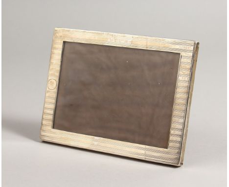 A RECTANGULAR ENGINE TURNED PHOTOGRAPH FRAME. Chester 1909.  7ins x 5.25ins.