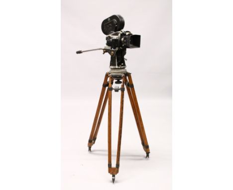 AN OLD ARRIFLEX FILM CAMERA, on an original tripod stand.