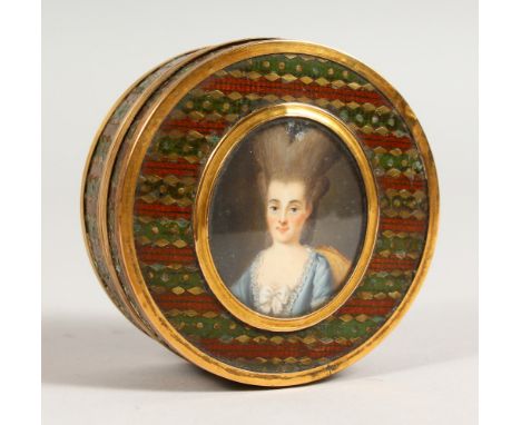 A GEORGE III CIRCULAR BRASS AND ENAMEL BOX, with oval portrait of a lady. 2.75ins diameter.
